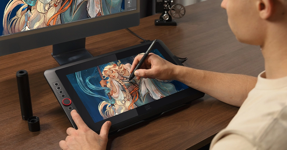 digital artist drawing on touchscreen monitor