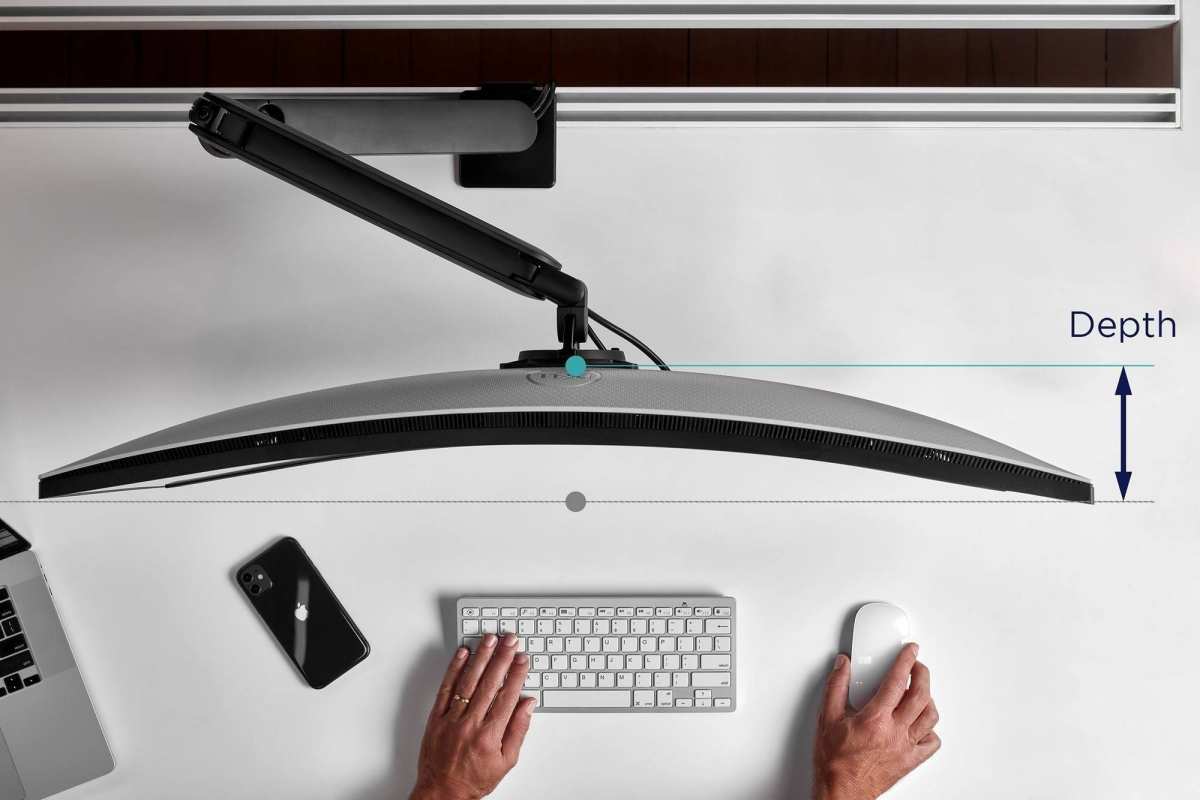 ergonomic monitor arm setup on desk