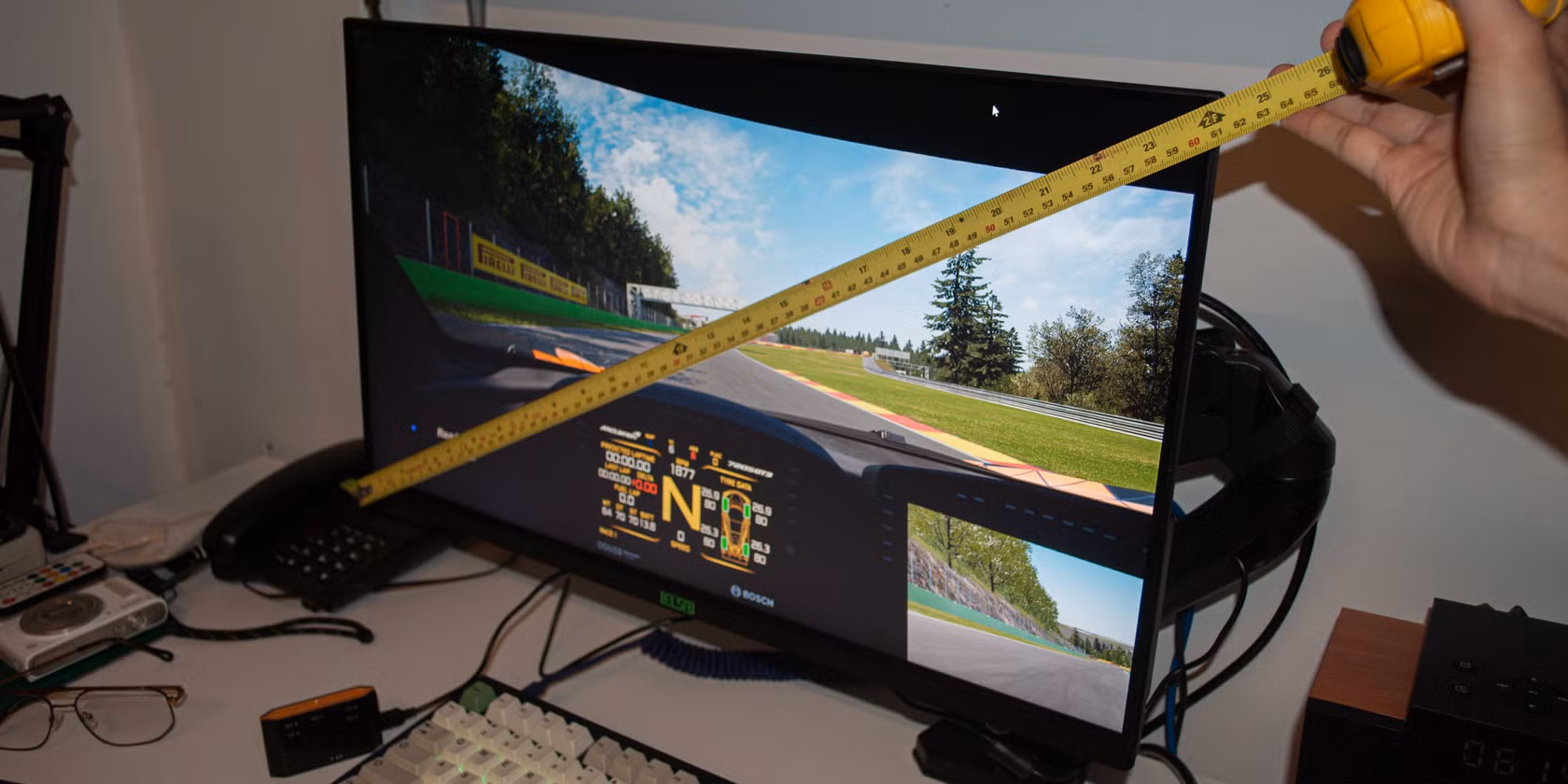 gaming desk setup with curved monitor