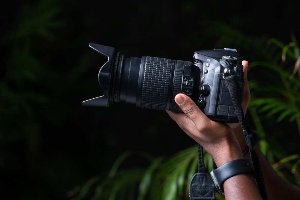 holding DSLR