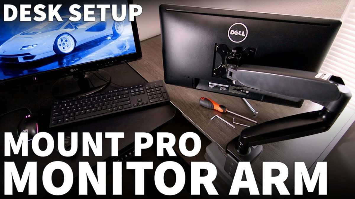 monitor arm clamped to desk saving space