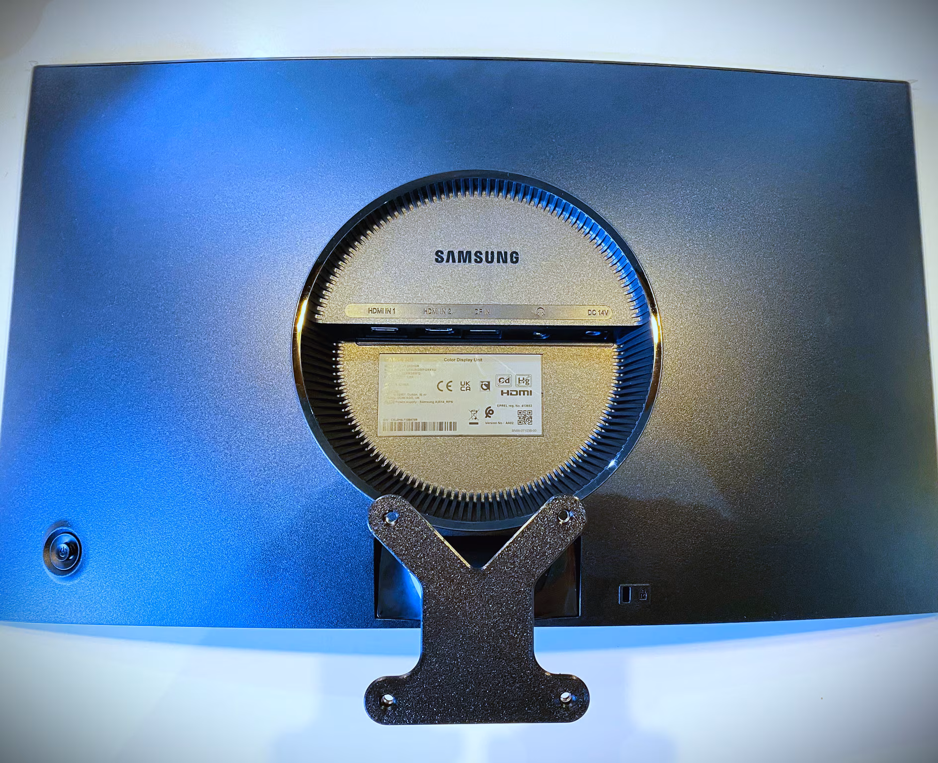 VESA mount plate attached to curved monitor back