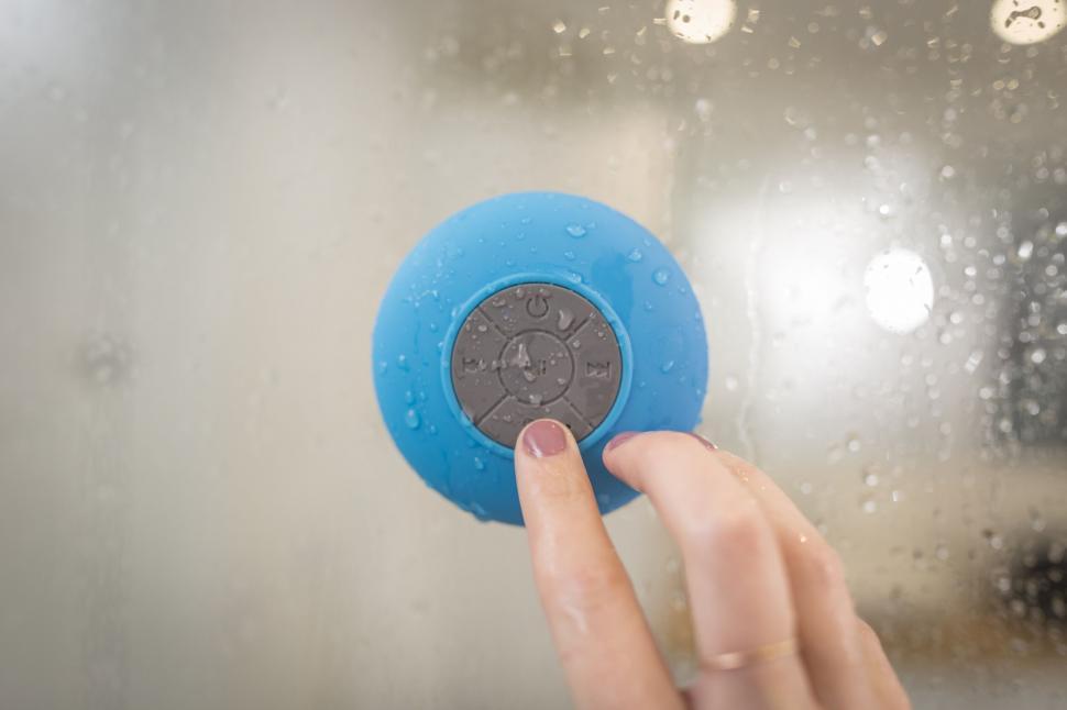pressing pairing button on speaker